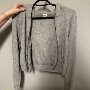 Aritzia TNA waffle crop top zip up, with hood.